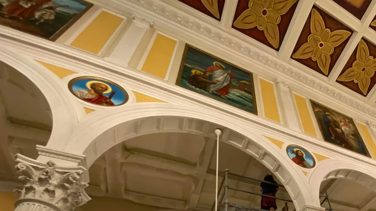 Restored altar murals and ceiling medallion at All Saints Catholic Church
