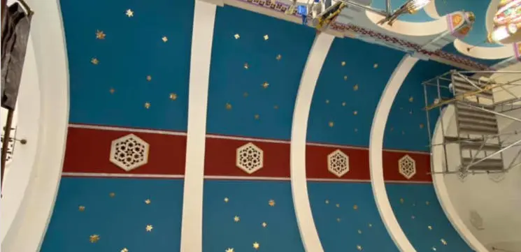 Artists detailing the St. Anthony Parish ceiling cross and stars