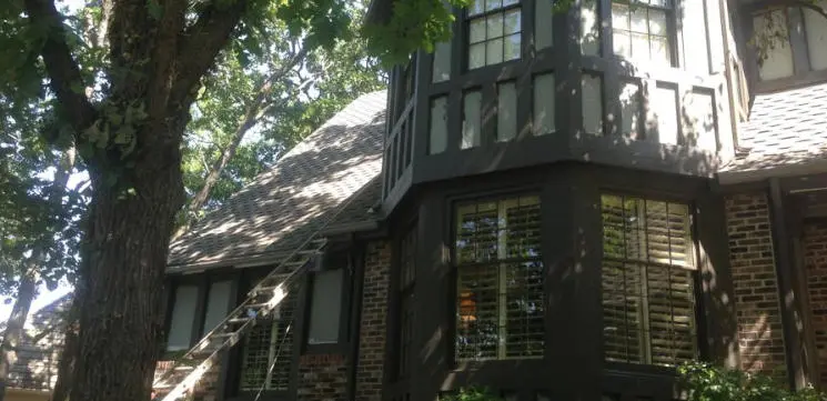Exterior painting crew working on Overland Park Kansas siding